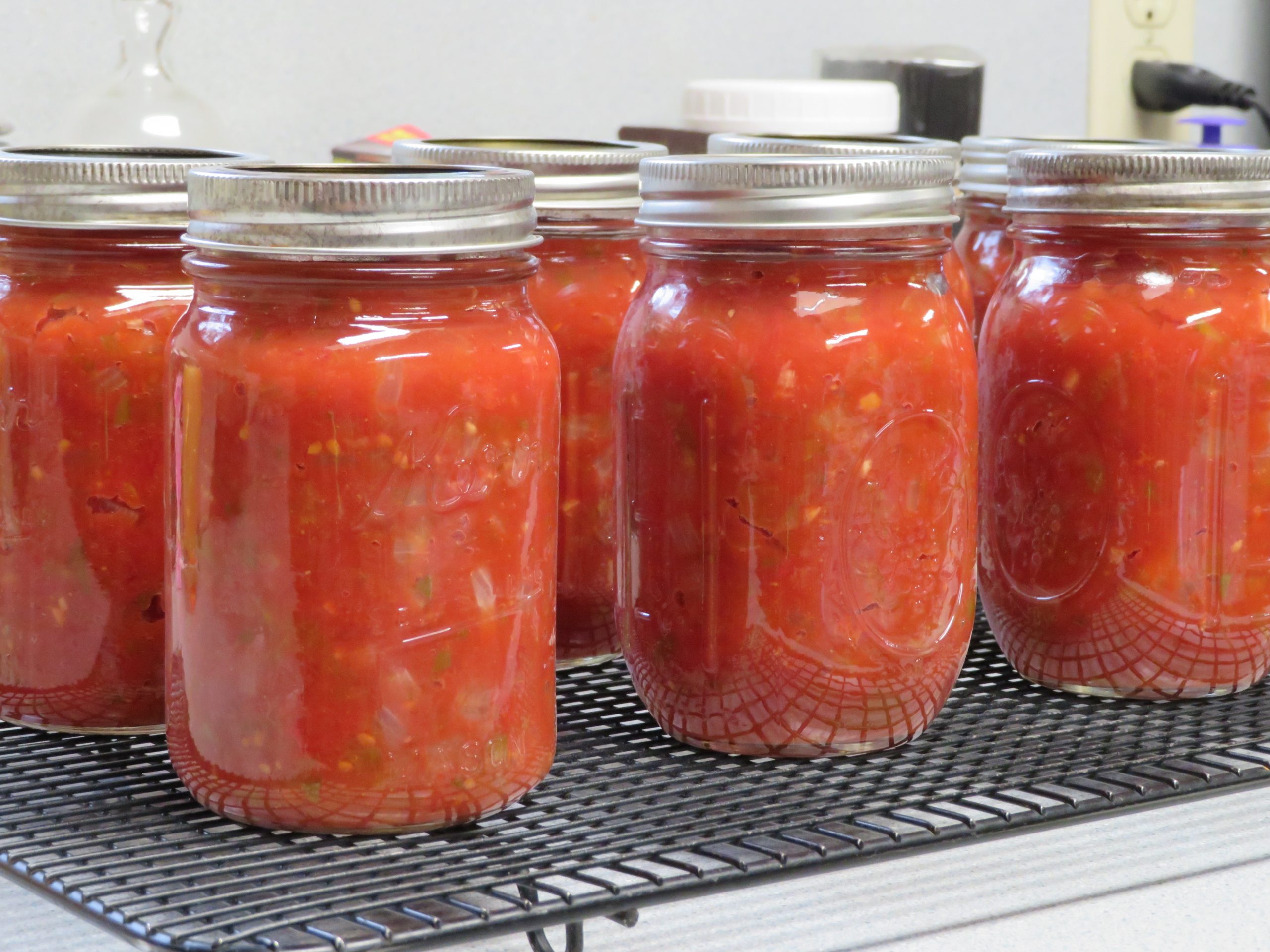 Pint jars of Hatch Chile and Canned Tomato Salsa