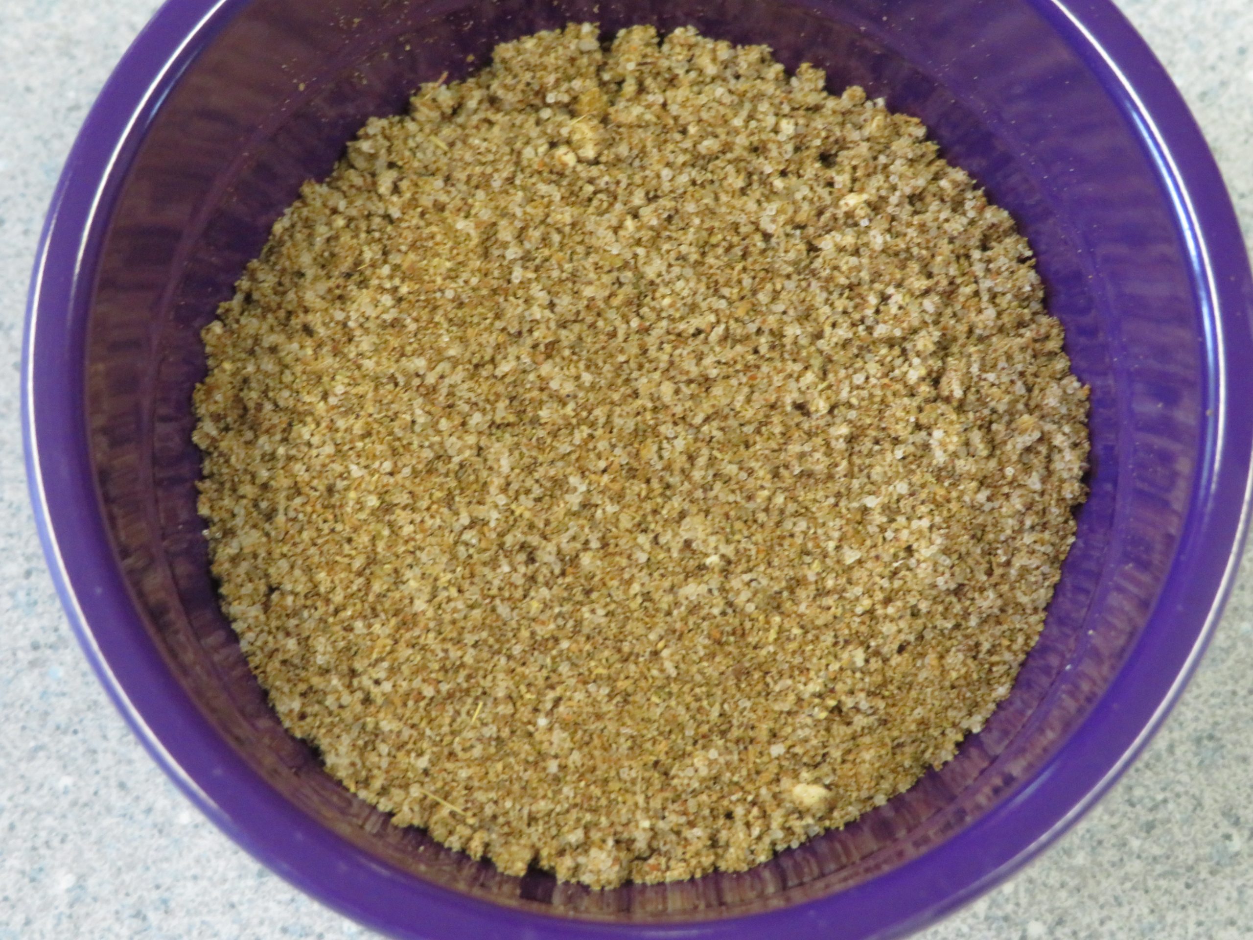 A small purple bowl of Tex-Mex Seasoning blend