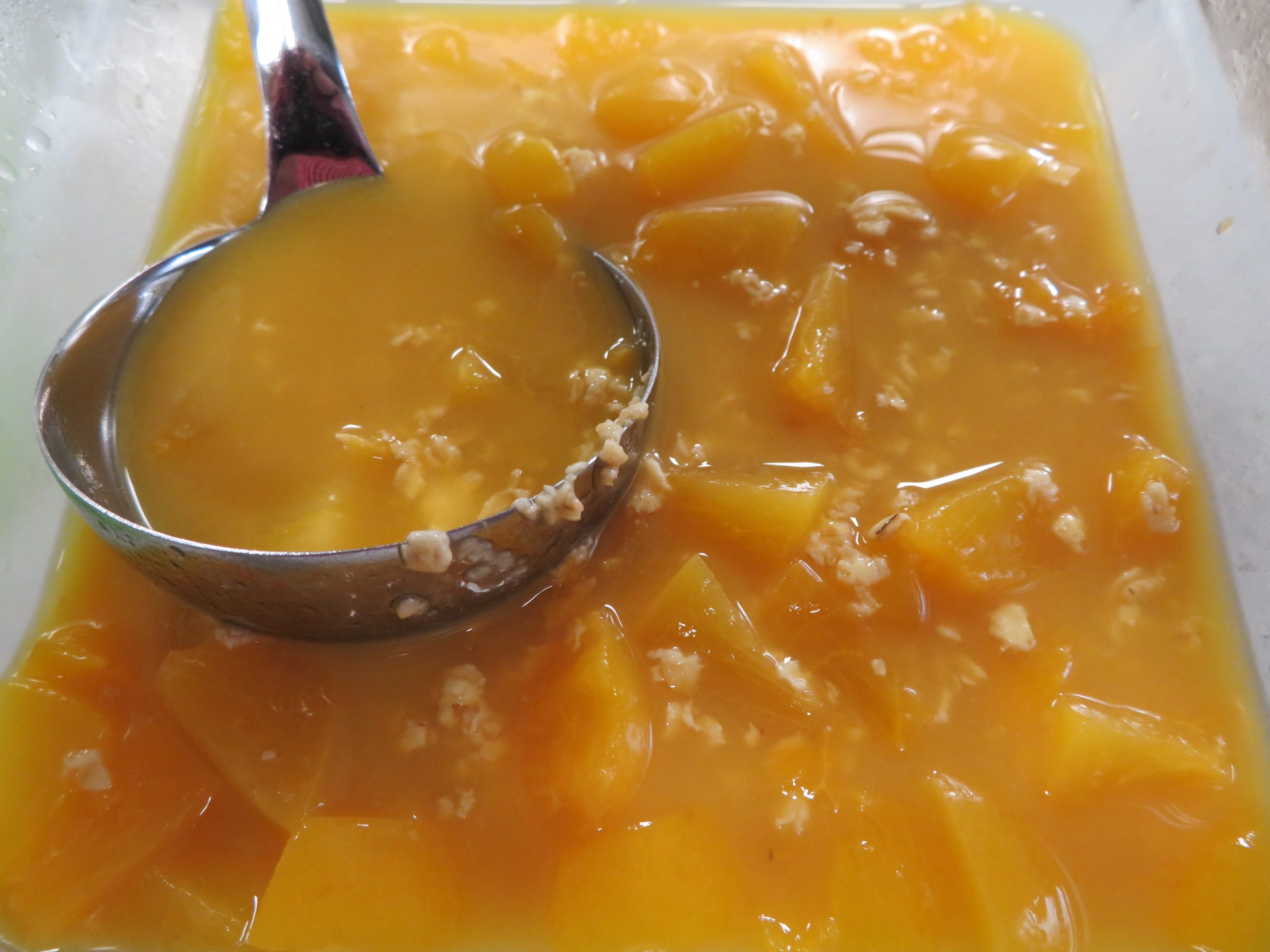 Ladeling Breakfast Soup out of a container