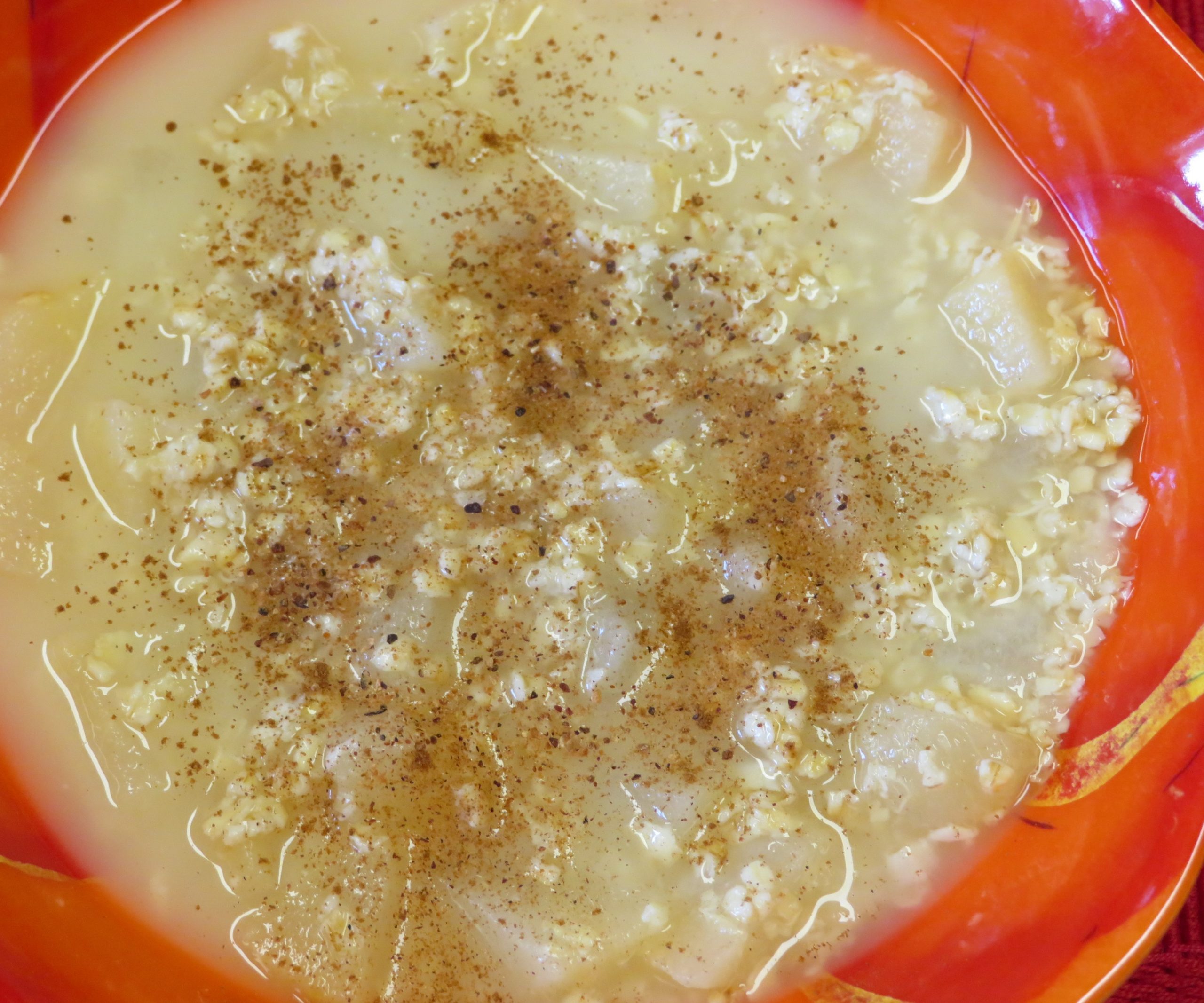 Breakfast Soup II in an orange bowl.