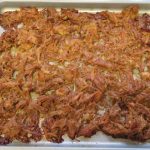 Roasted carnitas on a baking pan