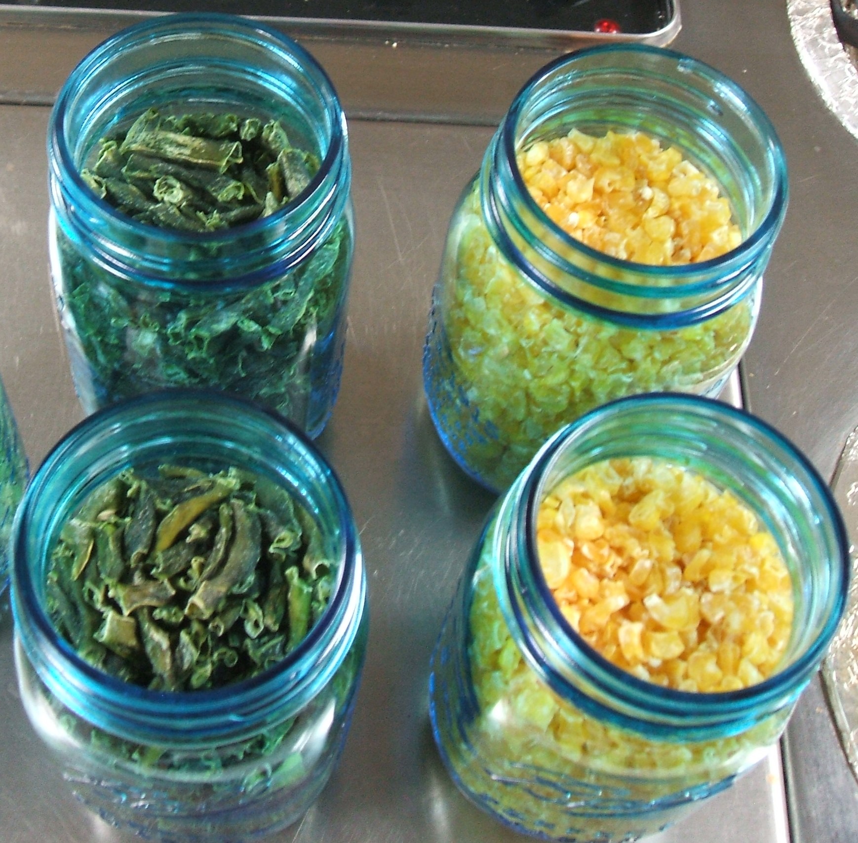 Jars of dried green beans and dried corn