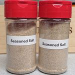 Two spice jars of seasoned salt