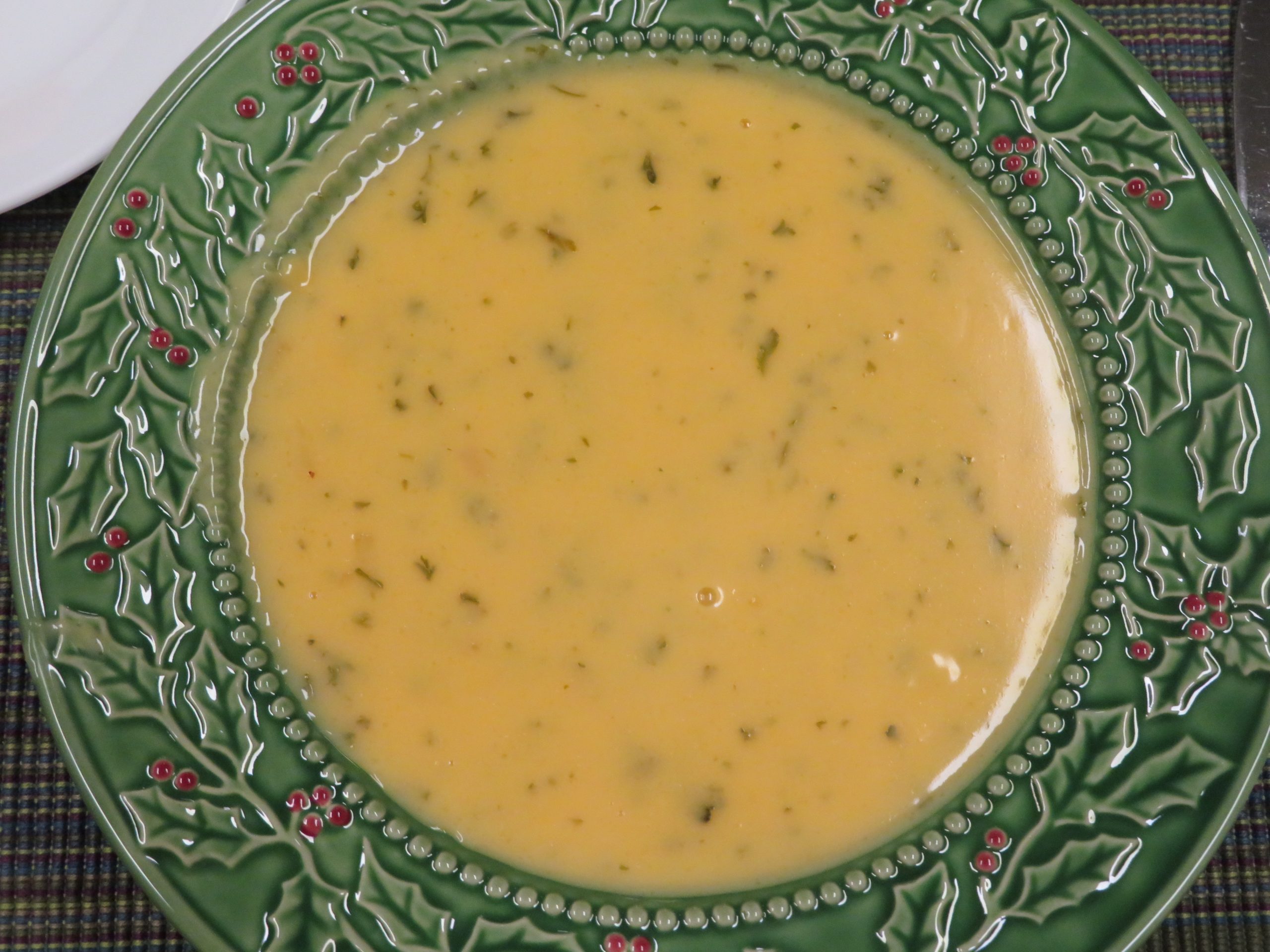 A bowl of Creamy Cheddar Broccoli Soup