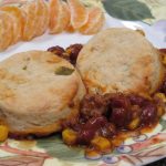 Chili Pot Pie on a plate with orange segments