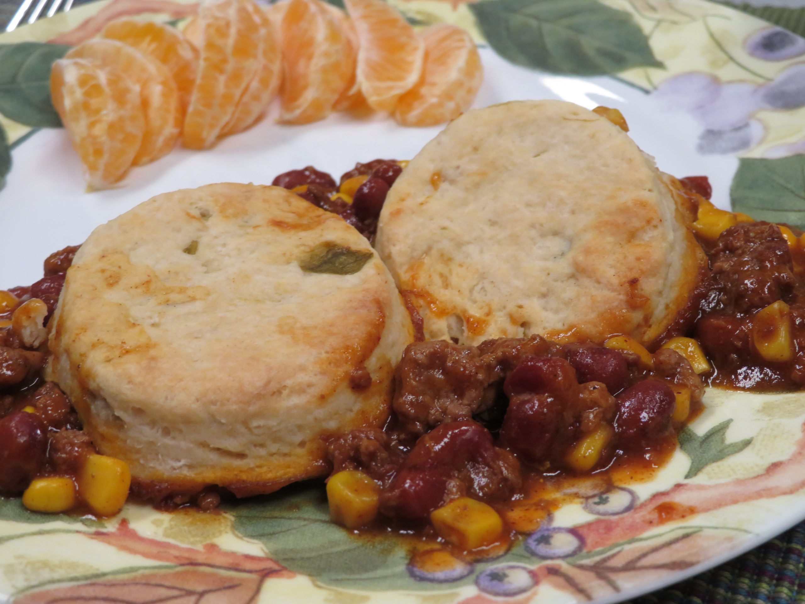 Chili Pot Pie on a plate with orange segments