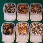 Six trail mixes in labeled plastic containers