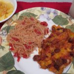 Dinner plate with Pantry Fideo and enchiladas, glass of milk, bowl of pineapple