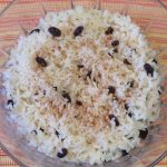 Quick Rice Pudding with raisins topped with cinnamon in a cut glass bowl