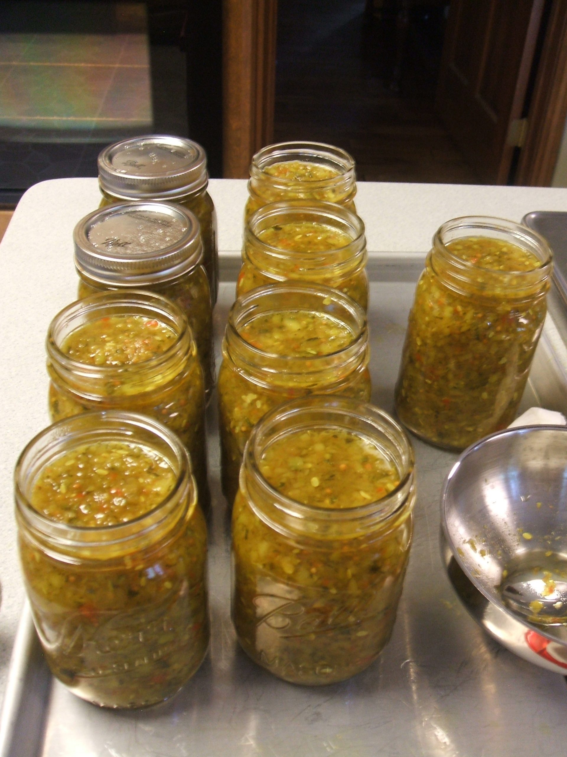 Jars of sweet zucchini relish ready for canning