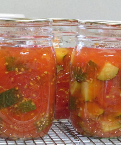 Pint jars of home canned tomatoes and zucchini