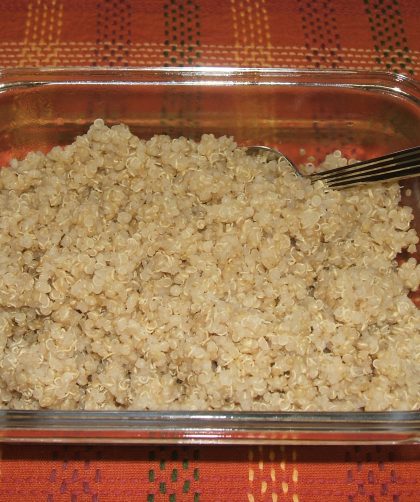 A clear square bowl of Herb Seasoned Quinoa