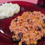 Black Bean Tomato Rice on a red plate