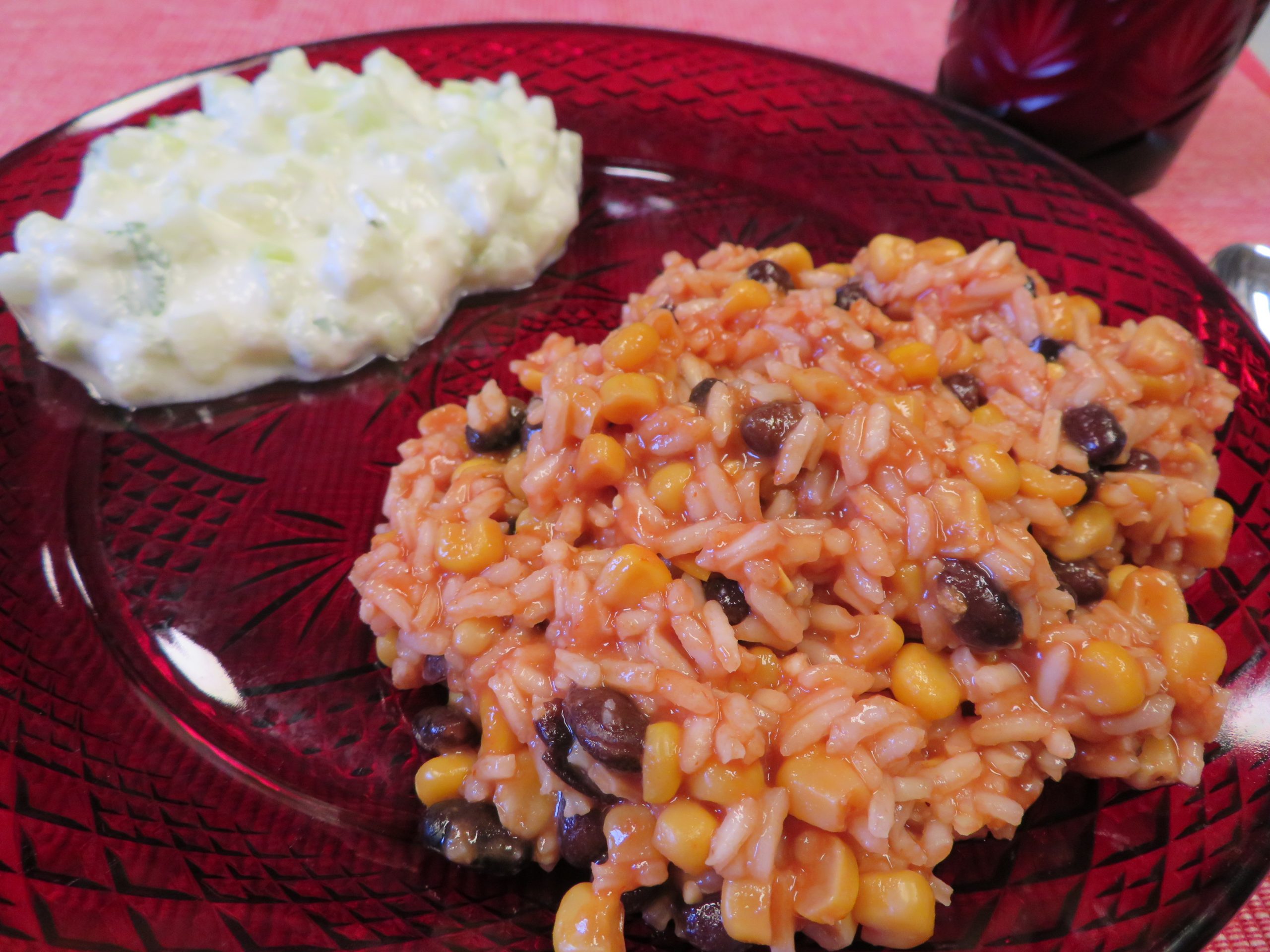 Black Bean Tomato Rice on a red plate